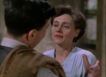 Movie still from “This Happy Breed” (1944), directed by David Lean – An older woman talking to a young man; Close Up shot, Over the shoulder angle