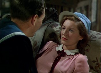 Movie still from “This Happy Breed” (1944), directed by David Lean – A man and a woman talking to each other; Medium shot, Over the shoulder angle