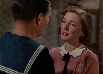 Movie still from “This Happy Breed” (1944), directed by David Lean – A man and a woman talking to each other; Close Up shot, Over the shoulder angle