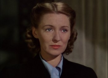 Movie still from “This Happy Breed” (1944), directed by David Lean – A person wearing a suit and tie; Close Up shot, High angle