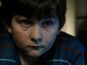 Movie still from “Threads” (1984), directed by Mick Jackson – A young boy's face; Close Up shot, Low angle