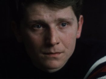 Movie still from “Threads” (1984), directed by Mick Jackson – A man's face in the dark; Close Up shot, High angle