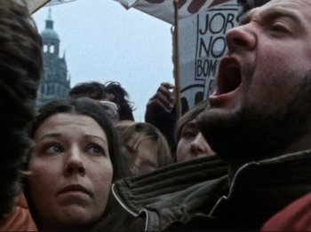 Movie still from “Threads” (1984), directed by Mick Jackson – A group of people protesting in the street; Close Up shot, High angle