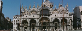 Movie still from “Three Coins in the Fountain” (1954), directed by Jean Negulesco – A large building with a lot of statues on it; Extreme Wide shot, Low angle