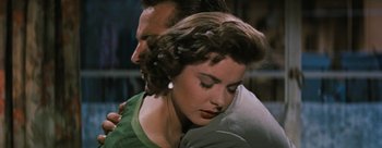 Movie still from “Three Coins in the Fountain” (1954), directed by Jean Negulesco – A man and a woman embracing each other; Close Up shot, Over the shoulder angle