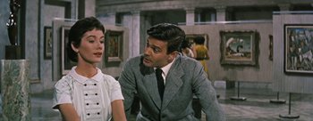 Movie still from “Three Coins in the Fountain” (1954), directed by Jean Negulesco – A man and a woman sitting in front of each other; Medium shot, Over the shoulder angle