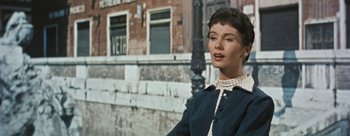 Movie still from “Three Coins in the Fountain” (1954), directed by Jean Negulesco – A person wearing a dress; Close Up shot, Over the shoulder angle