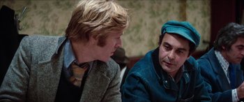 Movie still from “Three Days of the Condor” (1975), directed by Sydney Pollack – Two men are talking to each other in a room; Close Up shot, Over the shoulder angle