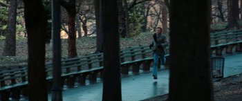 Movie still from “Three Days of the Condor” (1975), directed by Sydney Pollack – A man running on a path in a park; Wide shot, High angle