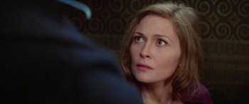 Movie still from “Three Days of the Condor” (1975), directed by Sydney Pollack – A person looking at something; Close Up shot, Over the shoulder angle