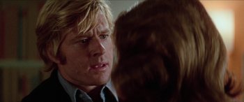 Movie still from “Three Days of the Condor” (1975), directed by Sydney Pollack – A person talking to another person; Close Up shot, Over the shoulder angle