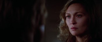 Movie still from “Three Days of the Condor” (1975), directed by Sydney Pollack – A woman's face in a dark room; Close Up shot, Over the shoulder angle