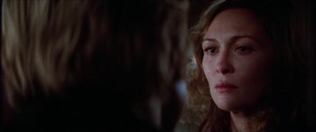 Movie still from “Three Days of the Condor” (1975), directed by Sydney Pollack – A woman's face with tears in her eyes; Close Up shot, Over the shoulder angle
