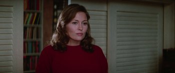 Movie still from “Three Days of the Condor” (1975), directed by Sydney Pollack – A person wearing a red shirt; Close Up shot, Low angle
