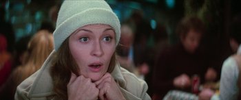 Movie still from “Three Days of the Condor” (1975), directed by Sydney Pollack – A person wearing a white hat; Close Up shot, Over the shoulder angle