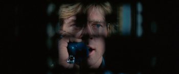 Movie still from “Three Days of the Condor” (1975), directed by Sydney Pollack – A man holding a remote control in his hand; Close Up shot, Low angle