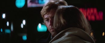 Movie still from “Three Days of the Condor” (1975), directed by Sydney Pollack – A person talking to another person; Close Up shot, Over the shoulder angle