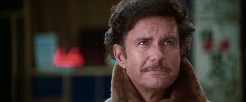 Movie still from “Three Days of the Condor” (1975), directed by Sydney Pollack – A person wearing a jacket; Close Up shot, Low angle