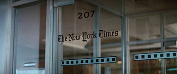 Movie still from “Three Days of the Condor” (1975), directed by Sydney Pollack – The new york times logo on a glass door; Extreme Close Up shot, Low angle