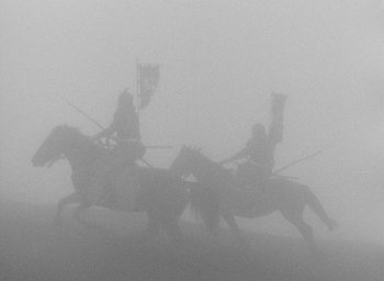 Movie still from “Throne of Blood” (1957), directed by Akira Kurosawa – Two men riding horses in the fog with flags; Extreme Wide shot, Low angle