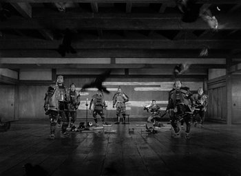 Movie still from “Throne of Blood” (1957), directed by Akira Kurosawa – A black and white photo of a group of people; Extreme Wide shot, Low angle