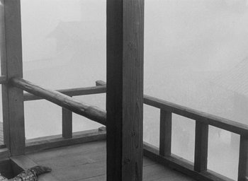 Movie still from “Throne of Blood” (1957), directed by Akira Kurosawa – A black - and - white photo of a wooden railing; Wide shot, Low angle