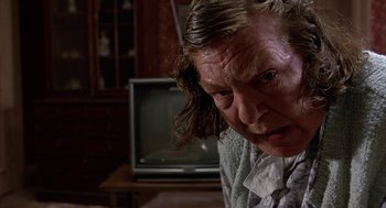 Movie still from “Throw Momma from the Train” (1987), directed by Danny DeVito – An older woman is looking at the camera; Close Up shot, Low angle