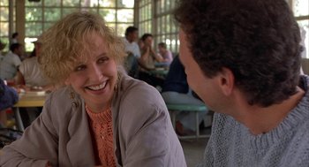 Movie still from “Throw Momma from the Train” (1987), directed by Danny DeVito – A woman and a man are talking to each other; Close Up shot, Over the shoulder angle