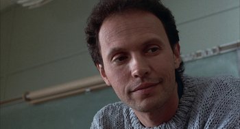 Movie still from “Throw Momma from the Train” (1987), directed by Danny DeVito – A person wearing a sweater; Close Up shot, Low angle