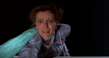 Movie still from “Throw Momma from the Train” (1987), directed by Danny DeVito – A person wearing a jacket; Close Up shot, Low angle