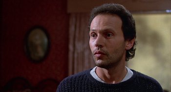 Movie still from “Throw Momma from the Train” (1987), directed by Danny DeVito – A person wearing a sweater; Close Up shot, Low angle