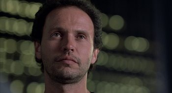 Movie still from “Throw Momma from the Train” (1987), directed by Danny DeVito – A person looking up at the sky; Close Up shot, Low angle