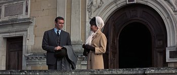 Movie still from “Thunderball” (1965), directed by Terence Young – A man and a woman standing next to each other; Medium shot, Low angle