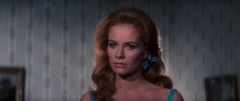 Movie still from “Thunderball” (1965), directed by Terence Young – A beautiful woman with long hair and a blue bow in her hair; Close Up shot, Low angle