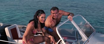 Movie still from “Thunderball” (1965), directed by Terence Young – A man and a woman on a boat in the water; Medium shot, Low angle