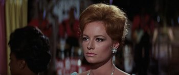 Movie still from “Thunderball” (1965), directed by Terence Young – A person wearing a dress; Close Up shot, Over the shoulder angle