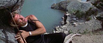 Movie still from “Thunderbolt and Lightfoot” (1974), directed by Michael Cimino – A man standing next to a body of water; Medium shot, Low angle