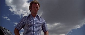 Movie still from “Thunderbolt and Lightfoot” (1974), directed by Michael Cimino – A person wearing a shirt; Medium shot, Low angle