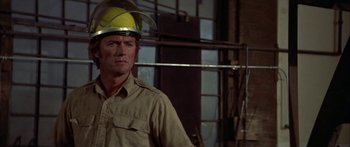 Movie still from “Thunderbolt and Lightfoot” (1974), directed by Michael Cimino – A person wearing a helmet; Close Up shot, Low angle