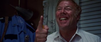 Movie still from “Thunderbolt and Lightfoot” (1974), directed by Michael Cimino – A man holding a yellow pencil in front of his face; Close Up shot, Low angle