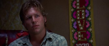 Movie still from “Thunderbolt and Lightfoot” (1974), directed by Michael Cimino – A person wearing a plaid shirt; Close Up shot, Low angle