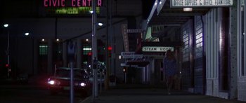 Movie still from “Thunderbolt and Lightfoot” (1974), directed by Michael Cimino – A woman walking down a street at night; Wide shot, Low angle