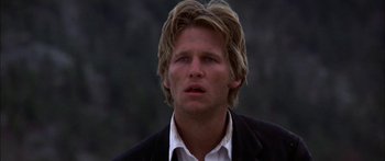 Movie still from “Thunderbolt and Lightfoot” (1974), directed by Michael Cimino – A person wearing a suit and tie; Close Up shot, Low angle