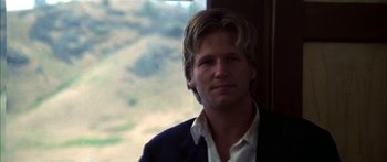Movie still from “Thunderbolt and Lightfoot” (1974), directed by Michael Cimino – A person wearing a suit and tie; Close Up shot, Low angle