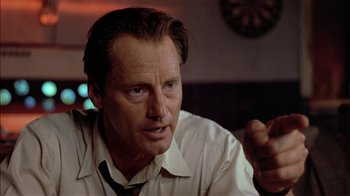 Movie still from “Thunderheart” (1992), directed by Michael Apted – A person wearing a shirt and a tie; Close Up shot, Low angle