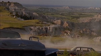 Movie still from “Thunderheart” (1992), directed by Michael Apted – A view from a car looking out over a valley; Extreme Wide shot, High angle