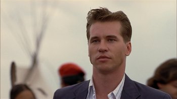 Movie still from “Thunderheart” (1992), directed by Michael Apted – A person wearing a suit; Close Up shot, Low angle