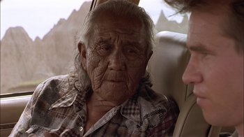 Movie still from “Thunderheart” (1992), directed by Michael Apted – An old woman sitting in a car looking at the camera; Close Up shot, Over the shoulder angle