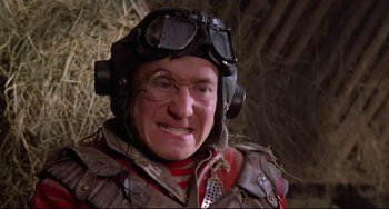 Movie still from “Time Bandits” (1981), directed by Terry Gilliam – An older man wearing a helmet and goggles; Close Up shot, Low angle