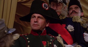 Movie still from “Time Bandits” (1981), directed by Terry Gilliam – A man in a military uniform wearing a hat; Close Up shot, Low angle